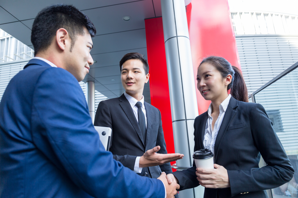 Businessman introduce a partner to his boss